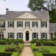 White limewash brick home exterior with a soft, natural mineral finish and subtle brick texture showing through.