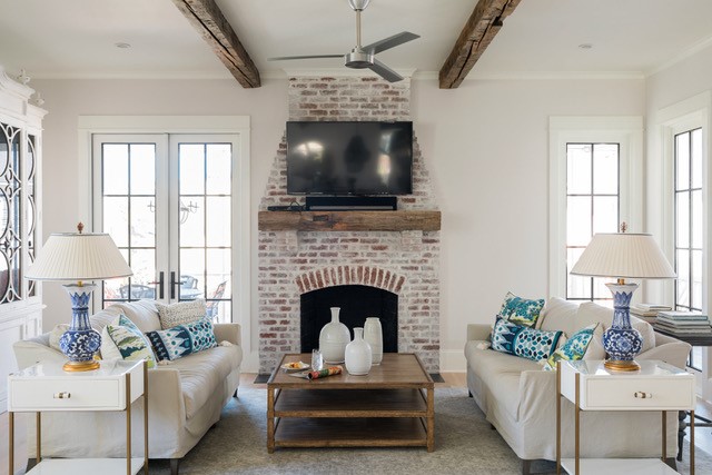 Limewash paint on brick fireplace in a home