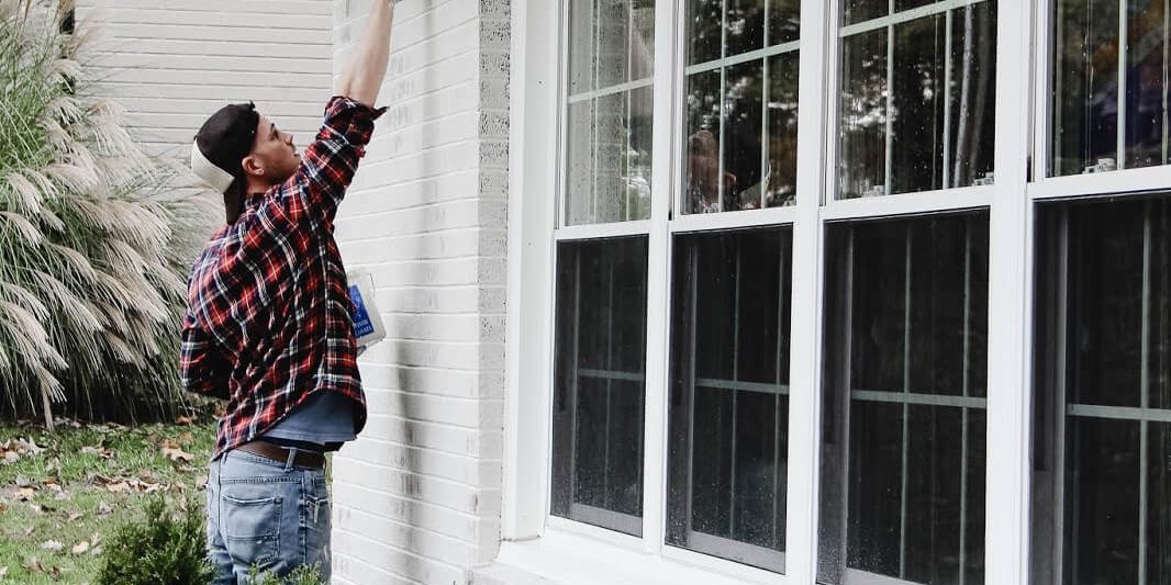 Painter Applying Classico Limewash Paint to Exterior Brick